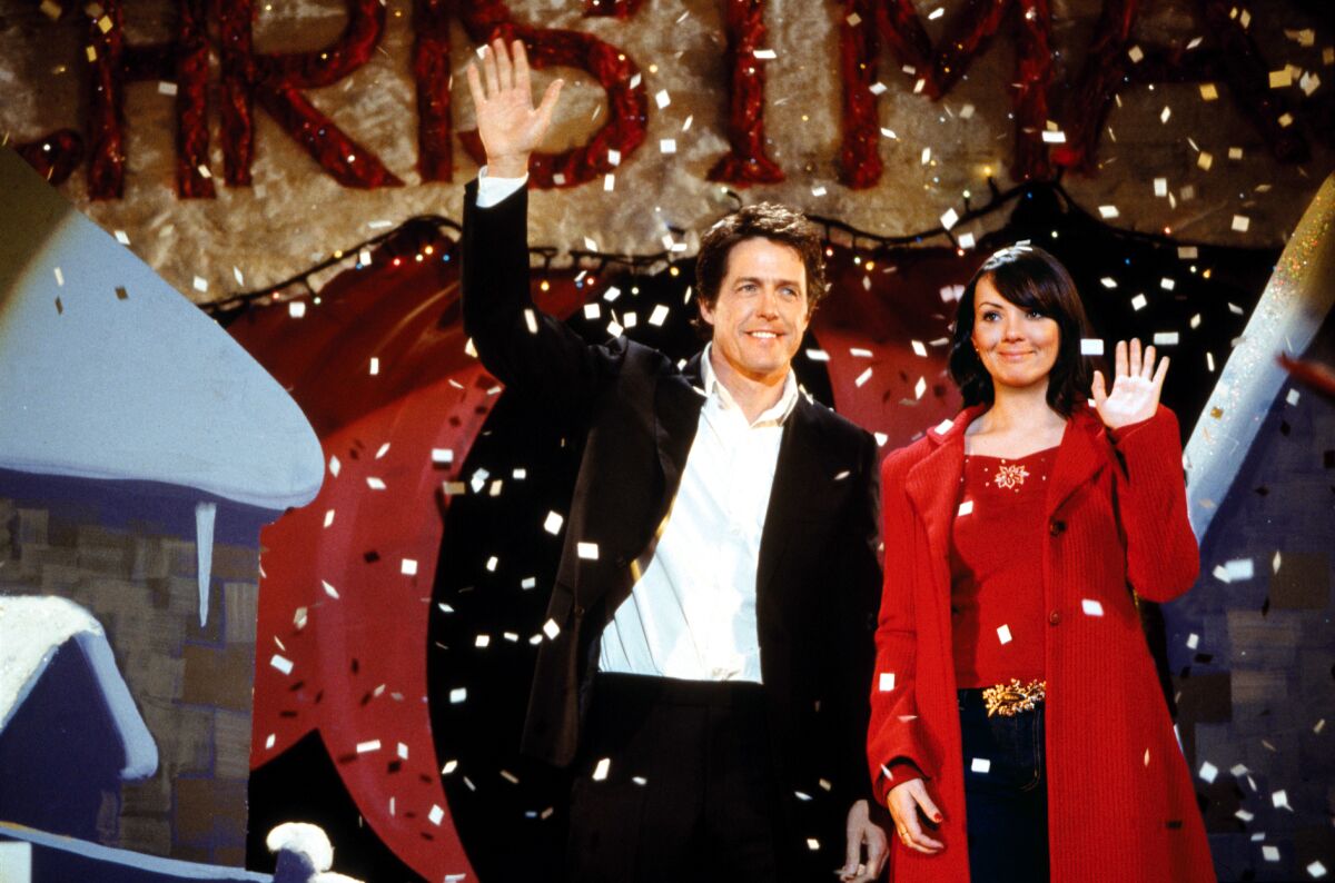 A couple is waving towards the audience in Christmas